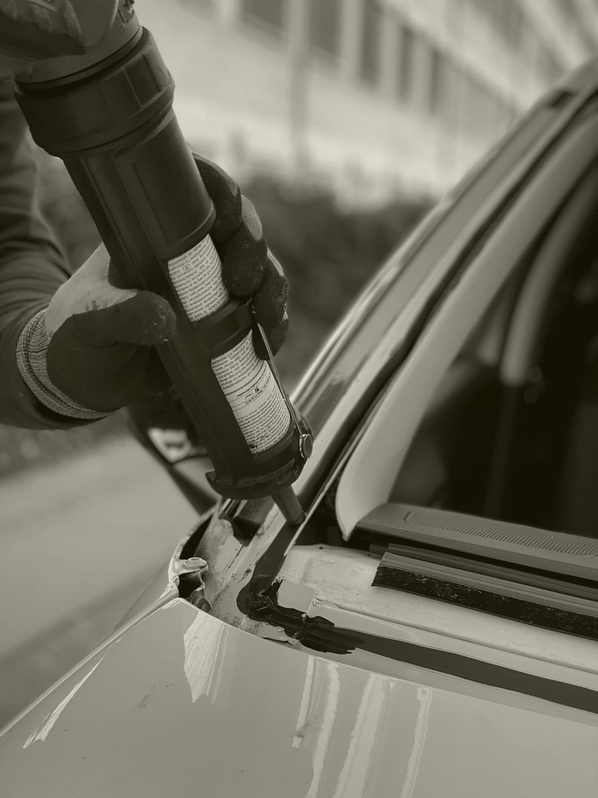 Technician installing a new windshield